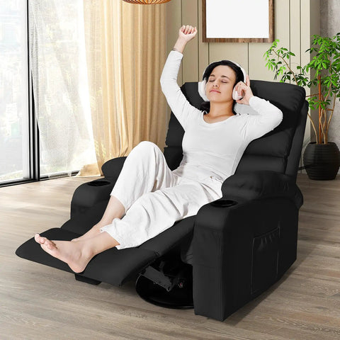 Person relaxing in a Rocking Recliner Chair With Massage And Heat, 360 Degree Swivel Faux Leather Lounge Chair in a living room.