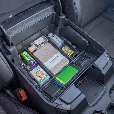 Full Center Console Organizer With Wireless Charging For 2022 2023 2024 2025 2026 Chevy Silverado And GMC Sierra 1500 2500HD 3500HD Crew Cab Fits Bucket Seats Only Keeps Phones Cables And Gear Neat Within Reach showing organized items in tray