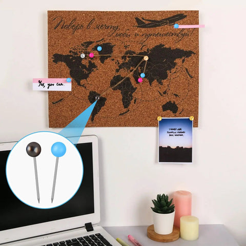 Super Dope 810 Piece Assorted Color Map Push Pins With Heavy Duty Stainless Steel Needles And Vivid Plastic Balls used to mark locations on a cork board.