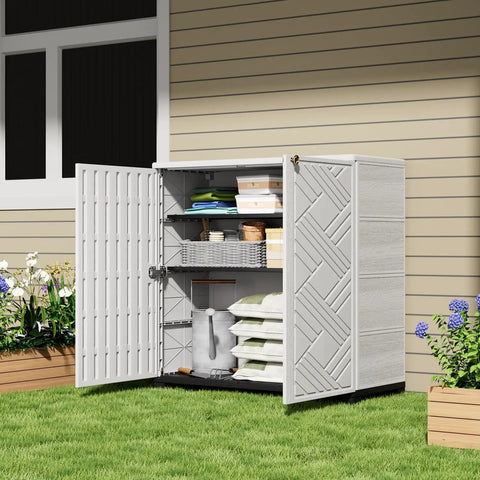Waterproof Outdoor Storage Cabinet With Two Shelves 60 Gallon Resin Shed open on patio with tools and supplies inside, white.