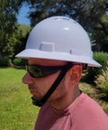 Man wearing Job Site Ready Full Brim Vented Hard Hat With 6 Point Ratchet System in garden