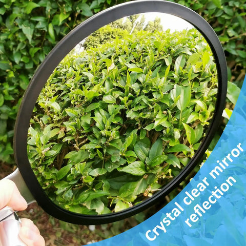 Handheld view of a crystal-clear mirror reflecting green leaves, part of Grab And Go Telescoping Under Vehicle Inspection Mirror.