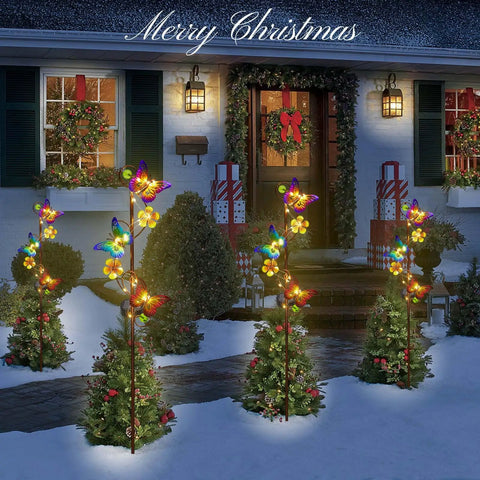 Solar Butterfly Garden Lights 2 Pack Outdoor Stake Decor With Waterproof Metal Butterflies And Flowers in yard at night