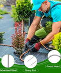 100 Pack Drip Irrigation Tubing Stakes Six Inch Garden Pins securing hose over weed barrier fabric in garden setup