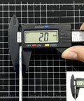 2mm LCD Repair Tape Kit With Tweezers For Screens showing 2mm tape measured by calipers on black grid background