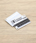 Straight Up Killer 2 Pack 5S Battery Management System 100A BMS Circuit Board on wooden surface, showcasing circuit layout and components.