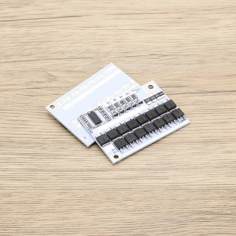Straight Up Killer 2 Pack 5S Battery Management System 100A BMS Circuit Board on wooden surface, showcasing circuit layout and components.