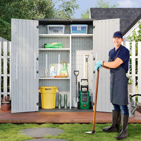 Man standing beside Outdoor Resin Storage Shed With Floor And Metal Shelving Kit 64 Cu Ft Waterproof Vertical Cabinet