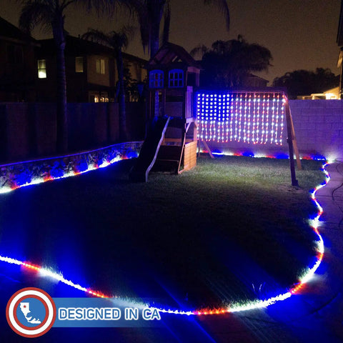 Patriotic Flag Curtain Lights With Stars 6 Ft By 3.5 Ft Outdoor Indoor Waterproof LED String Lights For Fourth Of July Parties 260 LEDs 16 Ft Power Cord UL Safety Low Voltage 110V To 29V displayed on a backyard playset at night