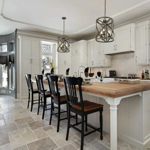 Open Cage Rustic Farmhouse 3 Light Pendant in Antique Black Iron for Cozy Country Living Vibes over kitchen island.
