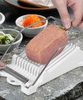 Person using Three Piece Clear Musubi Maker Kit With Luncheon Meat Slicer Non Stick Onigiri Press Mold BPA Free Sushi Mold