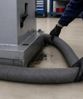 Heavy Duty Universal Absorbent Socks 12 Plus Pack Spill Containment Tubes Industrial Grade Oil Hydraulic Chemical Absorbers Pro Shop Garage Worksite Cleanup Gray being laid around equipment to contain a spill.