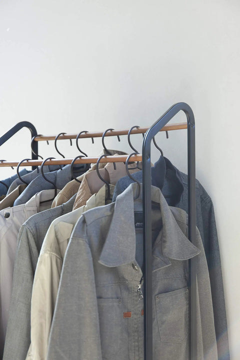 Kickass Rolling Wardrobe Rack With Staggered Wooden Bars And Roomy Bottom Shelf Built Tough With Steel Frames Delivers The Ultimate Flex For Portable Closet Setup Anywhere Glides On Smooth Casters