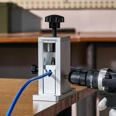 Drill Powered Wire Stripper Machine With Adjustable Feed Hole For Scrap Copper Wire 0.06 To 0.09 Inch in action on table