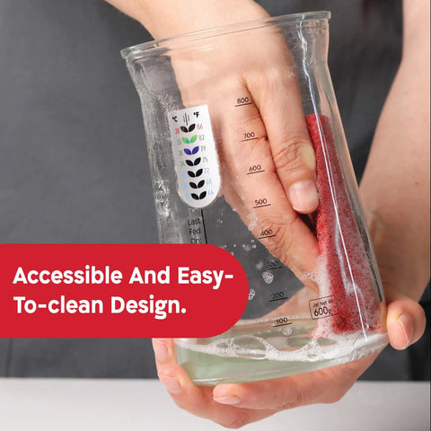 Hand cleaning 34 Oz Large Capacity Sourdough Starter Jar With Funnel Opening And Silicone Cover for easy maintenance.