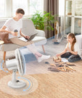 Oscillating Table Fan With Quiet Operation, 12 Inch Size, Three Speed Settings, Adjustable Tilt Head, Safety Grill in living room