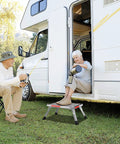 Non Slip Folding RV Steps With Adjustable Height, Lightweight Aluminum Step Stool, 4 Height Settings, Heavy Duty 1000 Pound Capacity, Non Slip Gripper Surface, Easy Stow And Go beside RV door