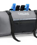 Mule 9 Bikepacking Waterproof Sideload Handlebar Pack With Easy Access Gear Pockets And Secure Attachment For Tents And Gear On Rough Trails Wolf Grey, front view with black straps and zippered pocket.