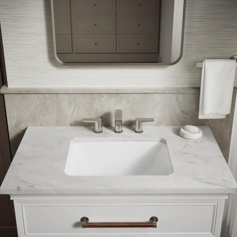 Roomy Rectangular Undermount Bathroom Sink With Overflow Drain Crafted From Hella Durable Vitreous China For An Easy Vanity Setup Bringing Straight Up White Finish And Really Smooth Daily Performance on marble countertop.
