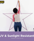 Person using Delicate Surface Painter’s Tape on wall for a star design. UV resistant 60 day clean removal, no adhesive transfer.
