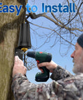 Installation of Outdoor 4G LTE Antenna With Wall Mount Waterproof SMA Male Connector Omnidirectional 5dBi Gain on a tree by a man with drill