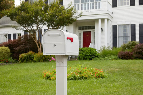 Oasis 360 Post Mounted Mailbox White, Heavy Duty Steel Build, Rust-Resistant Powder Coat, Weatherproof Outdoor Mailbox in front of house