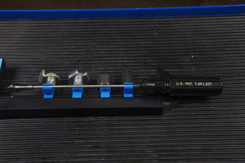 Drain Plug Pro Tool Kit with interchangeable attachments on rail, showing flexible 1/4 inch drive, for standard low profile and hex plugs.