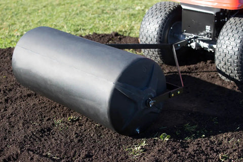 Tow Behind Lawn Roller 18-Inch By 36-Inch Heavy Duty Poly Roller With 40 Gallon Capacity For Flattening Gravel Dirt And More, attached to mower