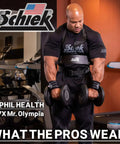 Man using Arm Blaster For Biceps Lightweight Durable And Ready For Intense Curl Sessions Anywhere in gym with dumbbells