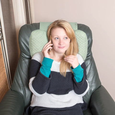 Woman using Recliner Neck Pillow With Pocket For Side Sleepers, Headrest Cushion For Neck Pain Relief, Green, on chair.