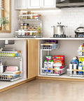 Image of Super Sturdy Two Tier Under Sink Organizer With Adjustable C Shape Base And Smooth Pull Out Rollers in kitchen cabinet.