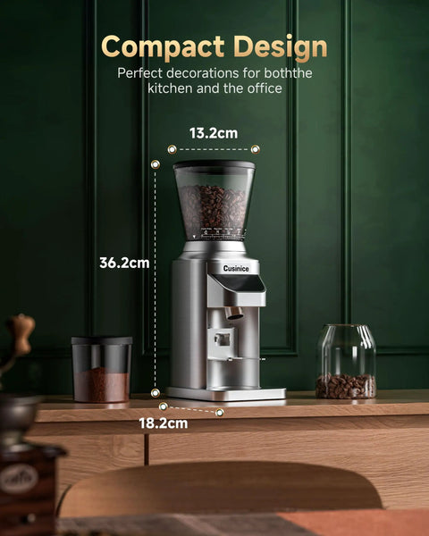Ditch The Clutter And Ditch The Static With This Sharp Conical Burr Coffee Grinder Rocking A Bold 40Mm Stainless Steel Core And Thirty Four Dial Tweaks To Keep Grinds Light And Flavor Rich For Any Home Barista Wanting That Daily Smooth Sip. Compact silver coffee grinder with a transparent bean hopper.