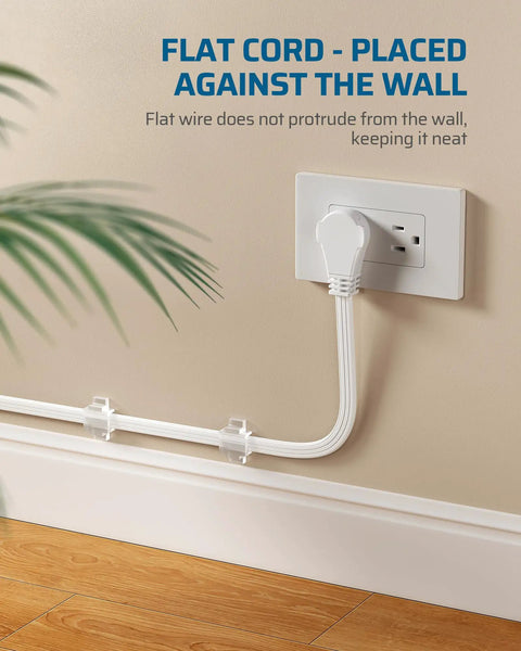 25 Ft Space Saving Flat Plug Extension Cord With 3 Prong Ultra Thin Power Strip And 360 Degree Rotating Plug 13A 125V 1625W 16 AWG Grounded Flat Cable For Indoor Tight Spots SPT3 ETL Listed White shown plugged in close to wall.