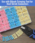 Front view of a clear storage case with pink, blue, and yellow heat-shrink butt connectors and a Qibaok crimp tool.