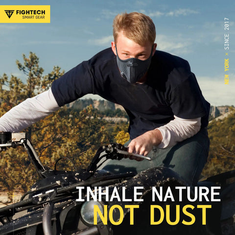 Man wearing Dust Face Mask With Extra Activated Carbon Filters And Air Valves For Woodworking And Construction Jobsites Pro Grade