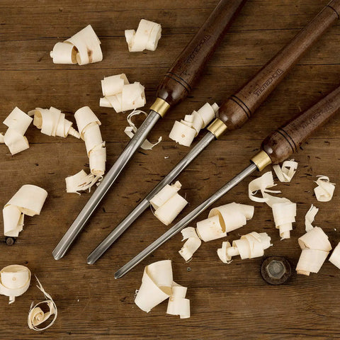 Badass 3 Piece HSS Bowl Gouge Set For Wood Turning Lathe Tools showing pre-sharpened chisels and wood shavings.