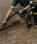 Person using Powerful Five Point Five Peak HP Wet Dry Vacuum With Twelve Gallon Tank Three In One Shop Vacuum With Blower Port