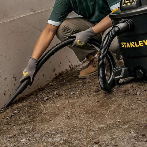 Person using Powerful Five Point Five Peak HP Wet Dry Vacuum With Twelve Gallon Tank Three In One Shop Vacuum With Blower Port