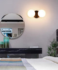 Dope Matte Black Two Light Globe Vanity Wall Sconce with Opal Glass Shades in modern bedroom setup