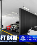4 Foot LED Shop Lights 84W 10000 Lumens Daylight 5000K Ultra Bright Lit Garage Lighting illuminating a modern garage with vehicles