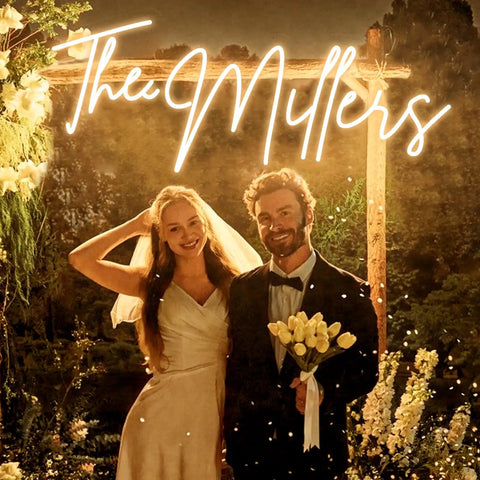 Bride and groom under custom neon sign LED light up name sign personalized for weddings bars salons and businesses lit name decor