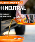 Pouring Ultra Shine Wash & Wax into a bucket from All In One Car Wash Kit With Ultra Shine Soap Plush Wash Mitt Microfiber Towel And Wax Buff For A Showroom Shine Without The Hassle