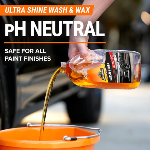 Pouring Ultra Shine Wash & Wax into a bucket from All In One Car Wash Kit With Ultra Shine Soap Plush Wash Mitt Microfiber Towel And Wax Buff For A Showroom Shine Without The Hassle