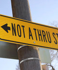 No Drill Beefy Sign Mounting Brackets For Large Poles With Adjustable Street Sign Hardware securing 'Not A Thru St' sign to pole.