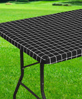 Black Waterproof Elastic Fitted Vinyl Table Cover 30x72 with flannel backing on picnic table outdoors