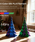 Tri-Color Silk PLA filament models in red, blue, green on table, showcasing Triple Color Gradient Silk PLA Filament 1.75mm For Ender 3 V2 And More.