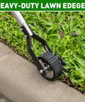Heavy Duty Rotary Wheel Lawn Edger With Adjustable 23.6 To 67 Inch Length, Stainless Steel Handle And Sharp Serrated Blades in use on sidewalk.