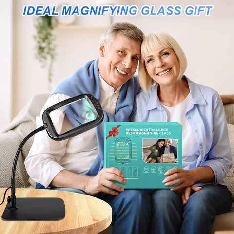 Couple holding Ultra Large Magnifying Glass with Light and Stand for reading and crafts, gift box on couch