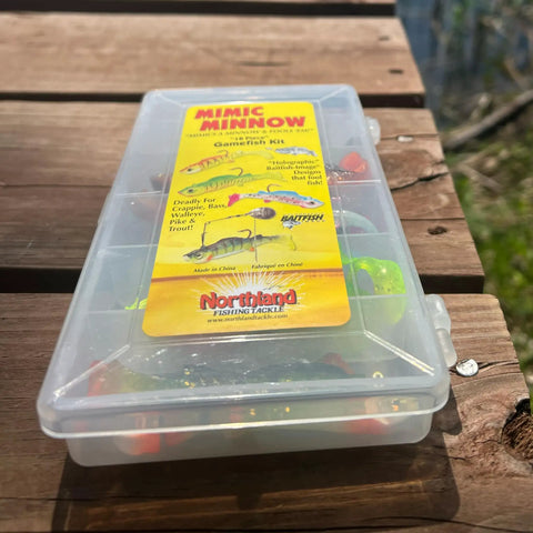 Mimic Minnow Swimbait Lure Kit With Jig Head Design Assorted Sizes And Colors packaging on a wooden surface