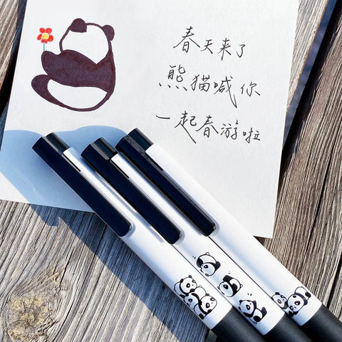 Three Panda Pattern Gel Ink Pens Set With All Black Ink 0.5mm Fine Point Comfortable Soft Grip ABS Pens next to a panda drawing